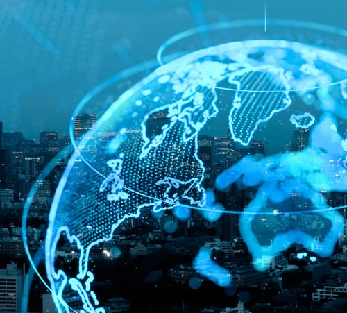 Image of a digital globe superimposed on an image of a city