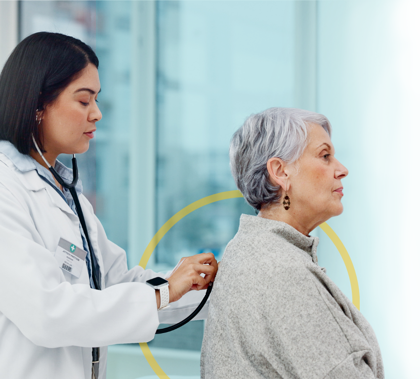 doctor checking the lungs of a female patient with a stethoscope doctor checking the lungs of a female patient with a stethoscope