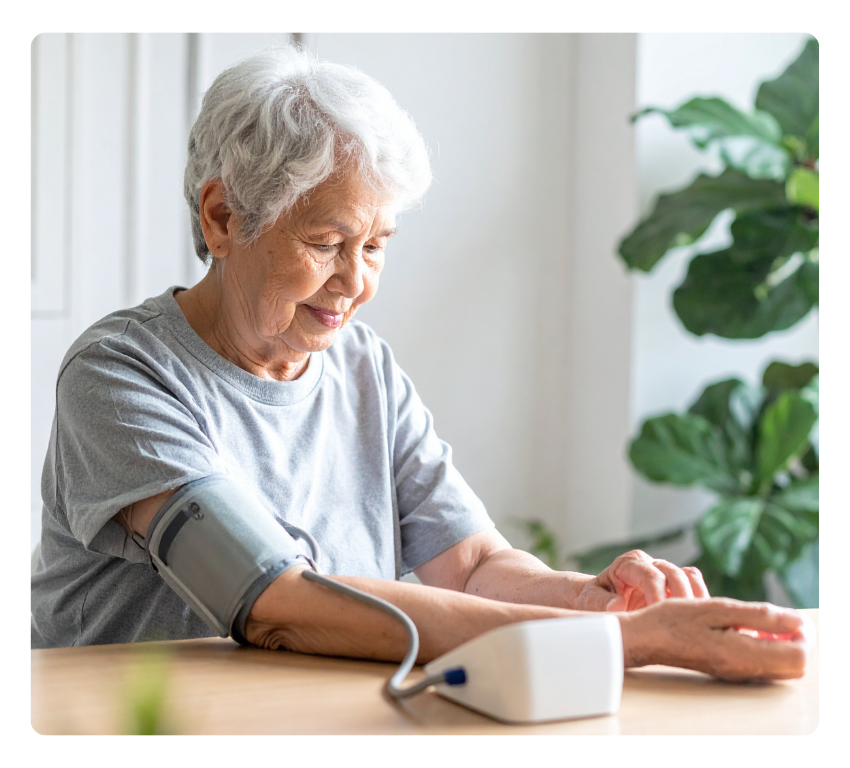 Elderly woman takes her blood pressure